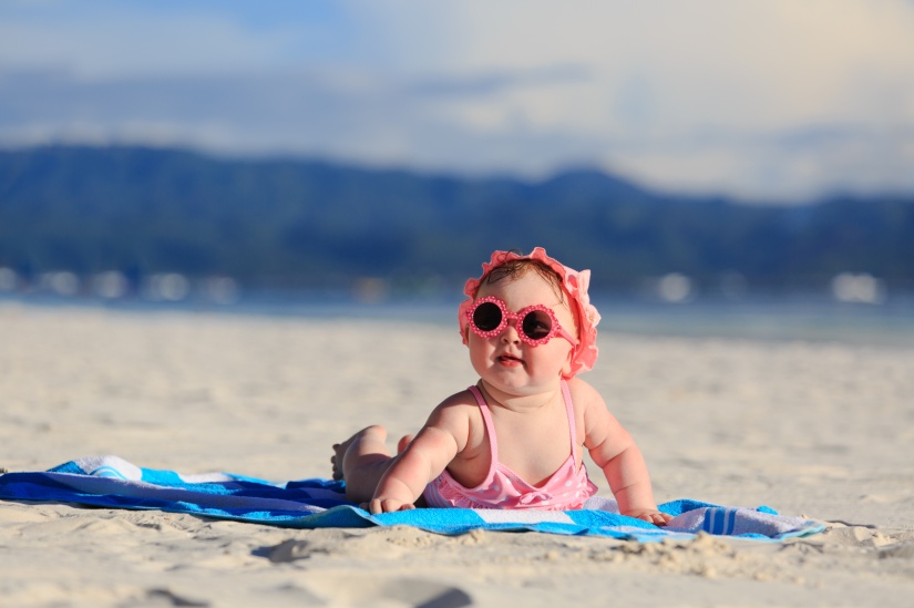 cute baby girl on tropical beach